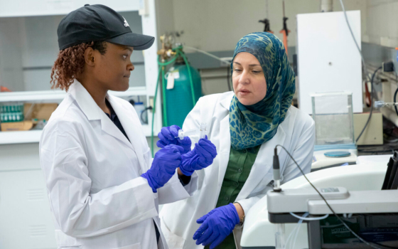 Dr. Lana Alagha, right, is working to help solve the critical minerals crisis. She is pictured here in a Missouri S&T mineral processing laboratory with former Ph.D. advisee Dr. Catherine Monyake. Photo by Tom Wagner/Missouri S&T. 