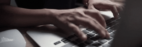 Person typing on keyboard