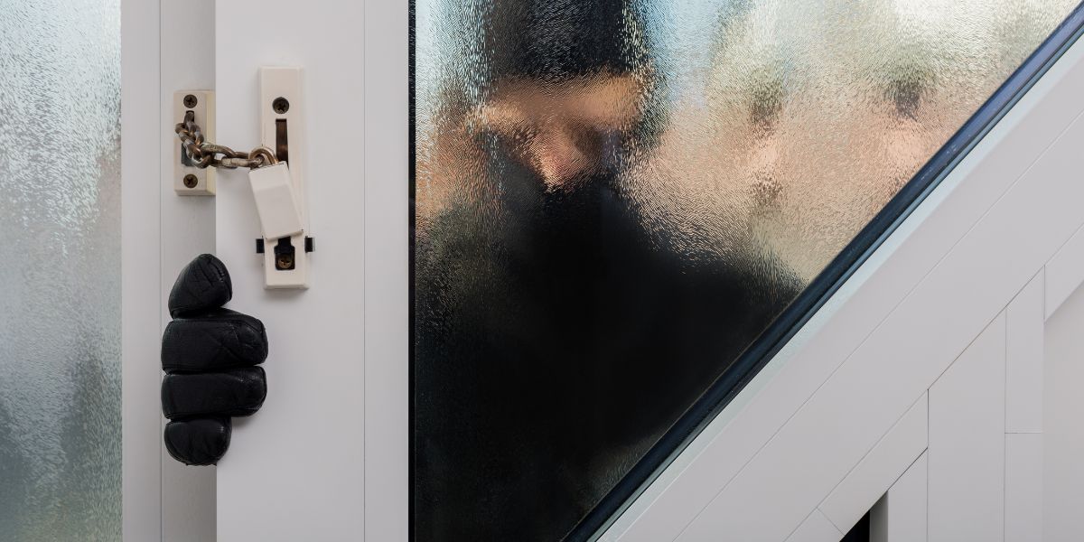 Burglar entering house