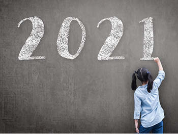 Artistic rendering of a child drawing with chalk "2021"