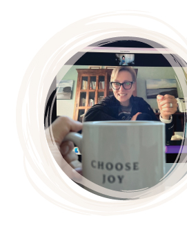 Helen at morning yoga practice; featuring "Choose Joy" mug