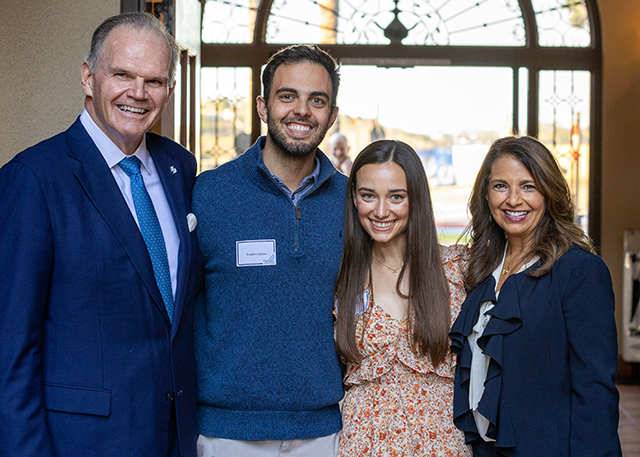 President Harris poses with students