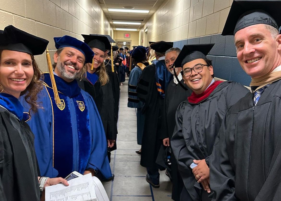 President Harris poses with students