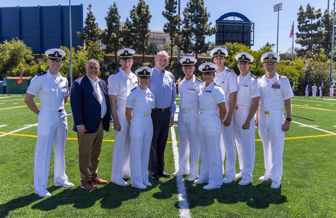 President Harris poses with students