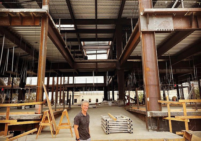 Photo of construction o the KCBE building with Chairman Knauss