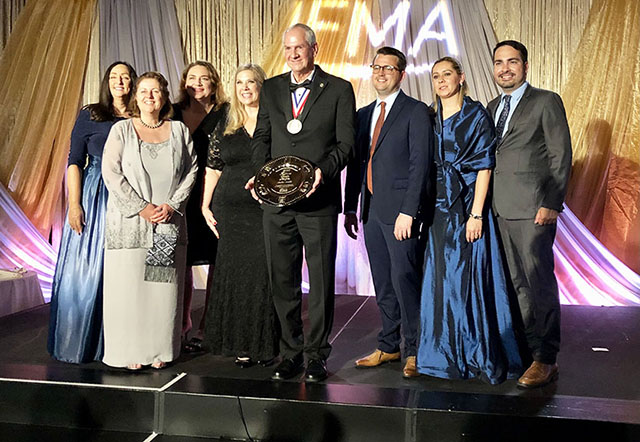 André Mallié poses with his Silver Plate Award