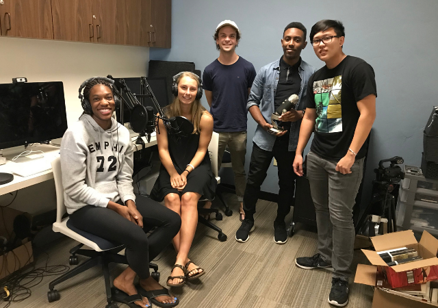 Image of students creating an episode for the Humanities Center's podcast There's More
