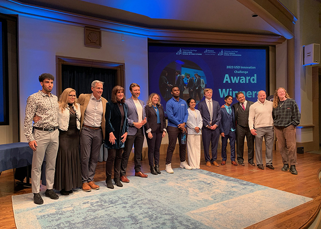 Winners of the Innovation Challenge pose with judges. 