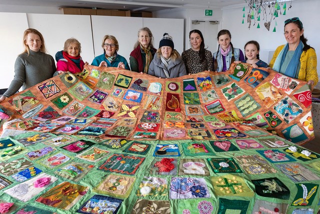 Photo of Brigid Cloak with some of its creators