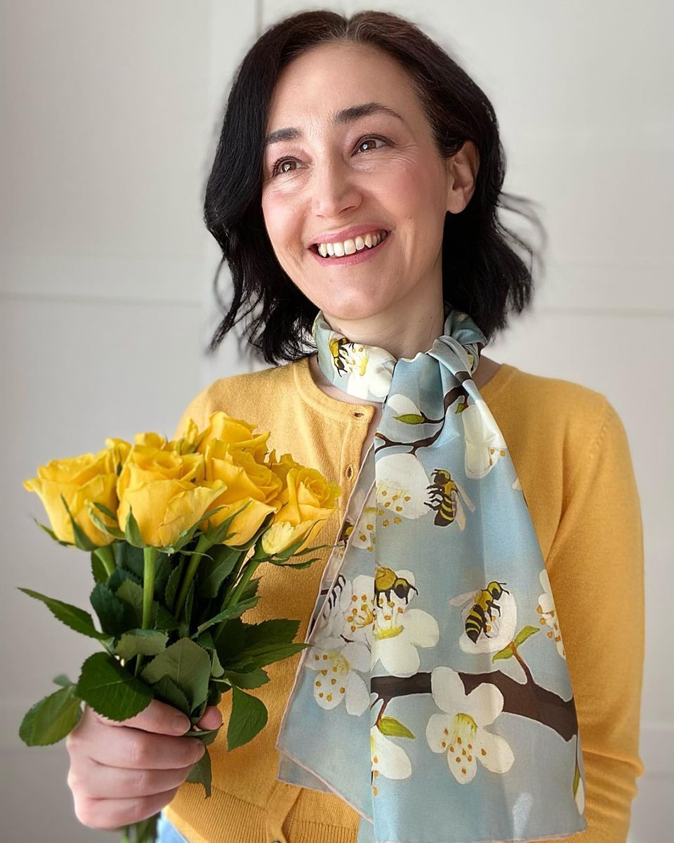 Emms wears Bees & Blossoms Silk Scarf by Fox & Chave