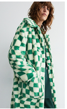 green check button through faux fur coat