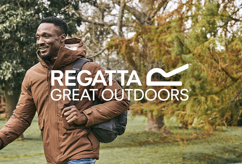 Man smiling, walking wearing a Regatta coat