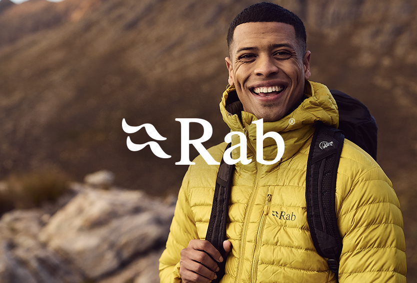 Man in a yellow down jacket smiling