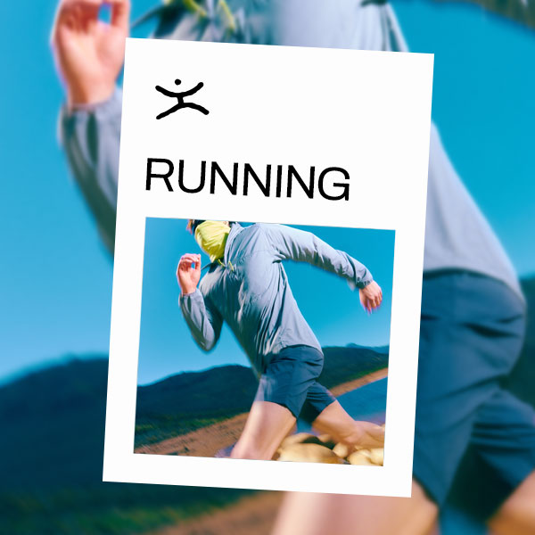 A man running through a dry mountainous region wearing a buff over his mouth.