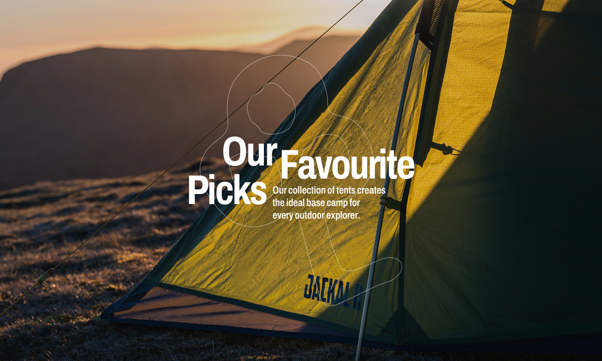 Camping tent pitched on a mountainside at sunrise, with warm golden light illuminating the yellow tent fabric from behind. Rolling hills fade into the background under a soft sky. 