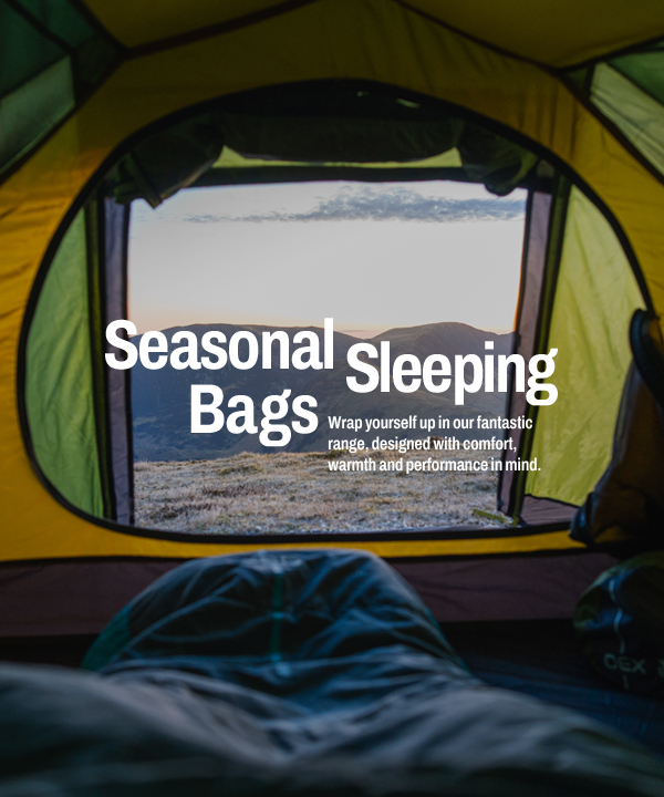 View from inside a camping tent looking out toward a mountainous landscape, with a sleeping bag in the foreground and large overlaid text reading “Seasonal Sleeping Bags.”