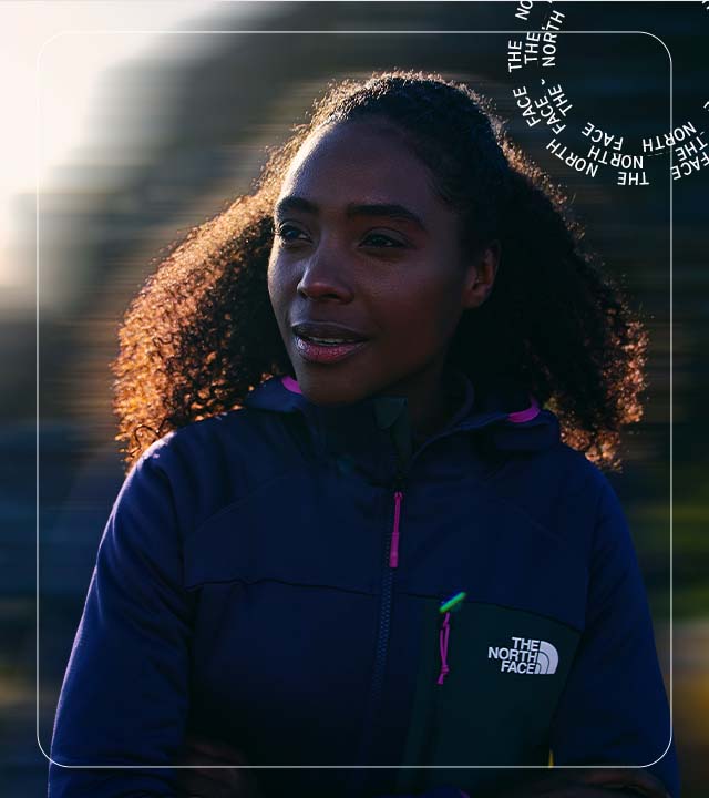 Woman wearing The North Face Jacket on a hike