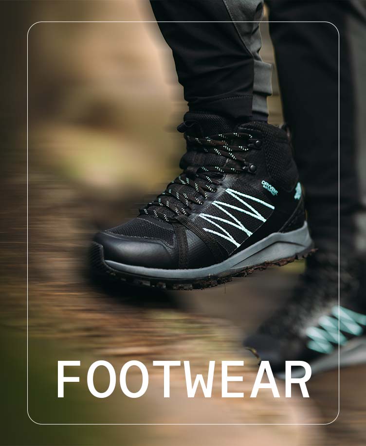 Person wearing TNF walking boots on a hike