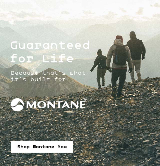 Group of men wearing Montane hiking up a mountain