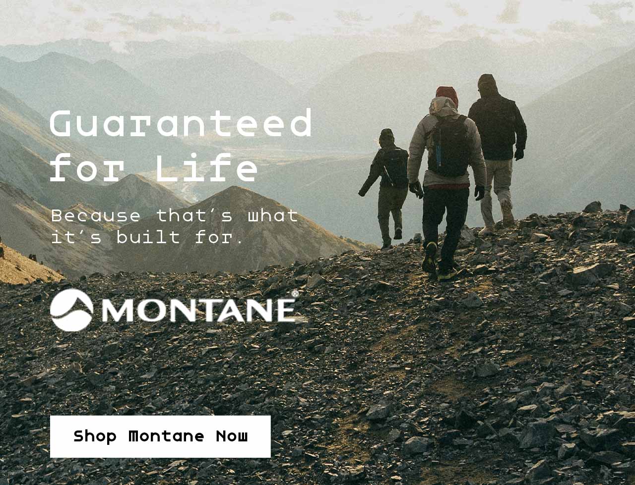 Group of men wearing Montane hiking up a mountain