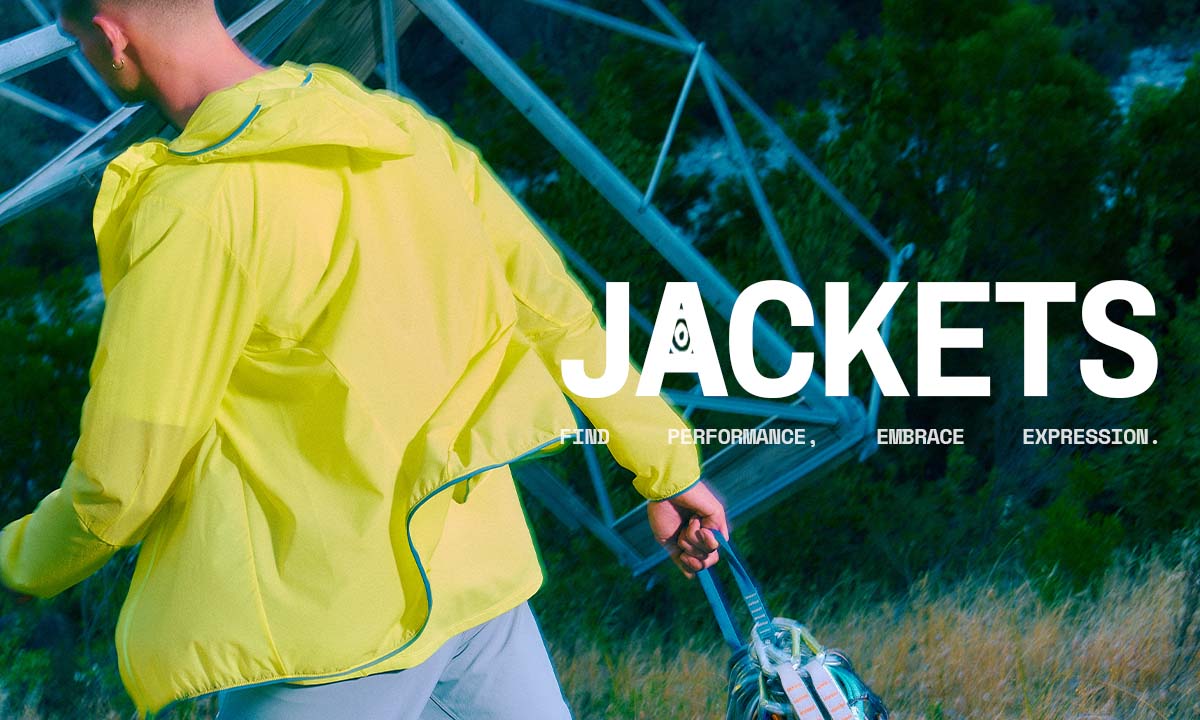 Man walking away, wearing a bright yellow windbreaker jacket