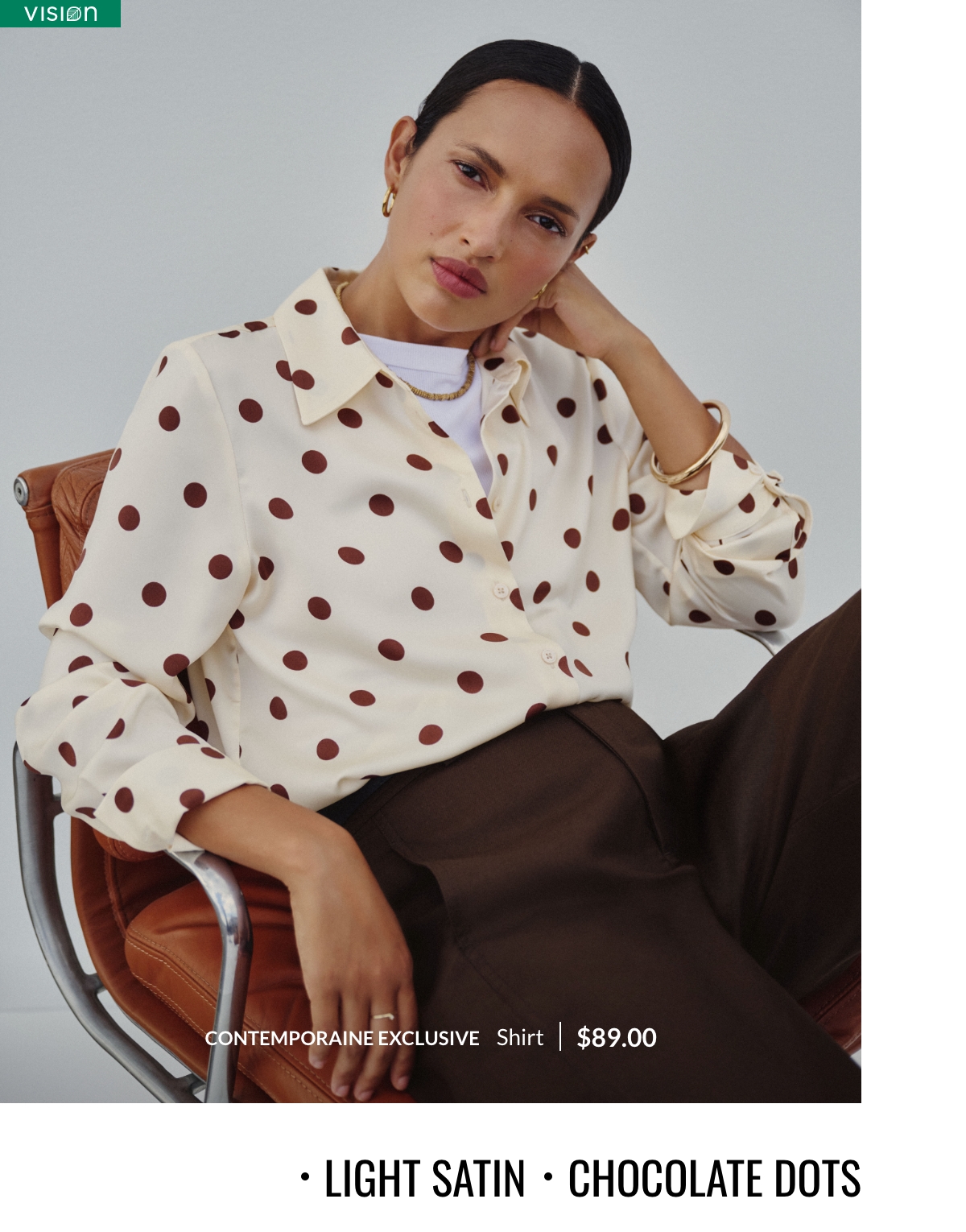 Light satin, chocolate dots. Woman wearing an ivory satiny shirt with brown polka dots, a Contemporaine exclusive design at 89$.