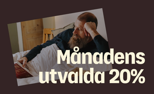 Skäggig man ligger i sängen och läser en bok, med stor text över bilden: ”Månadens utvalda 20%”.