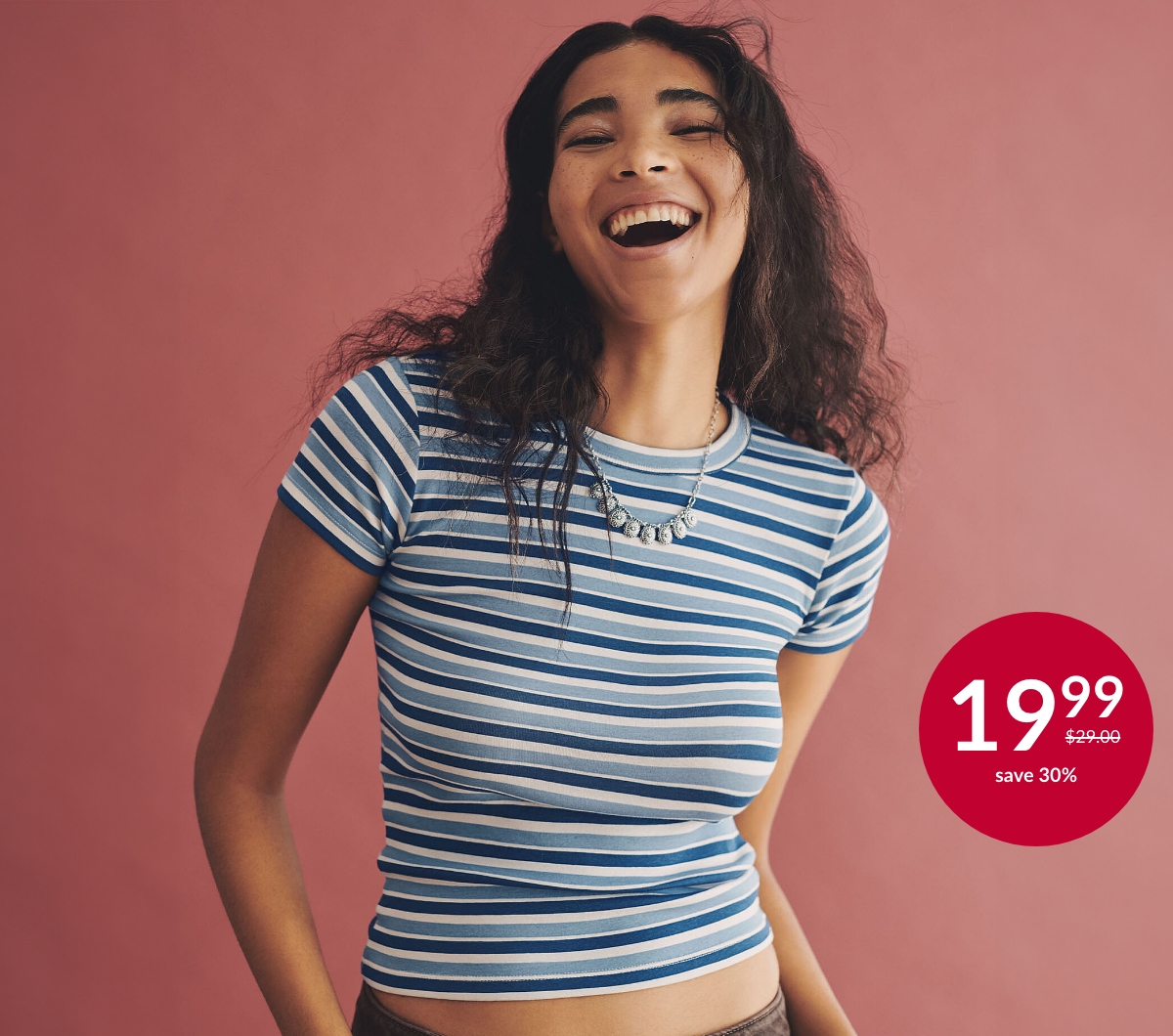 Young woman wearing a striped t-shirt at 19.99$ instead of 29.00$