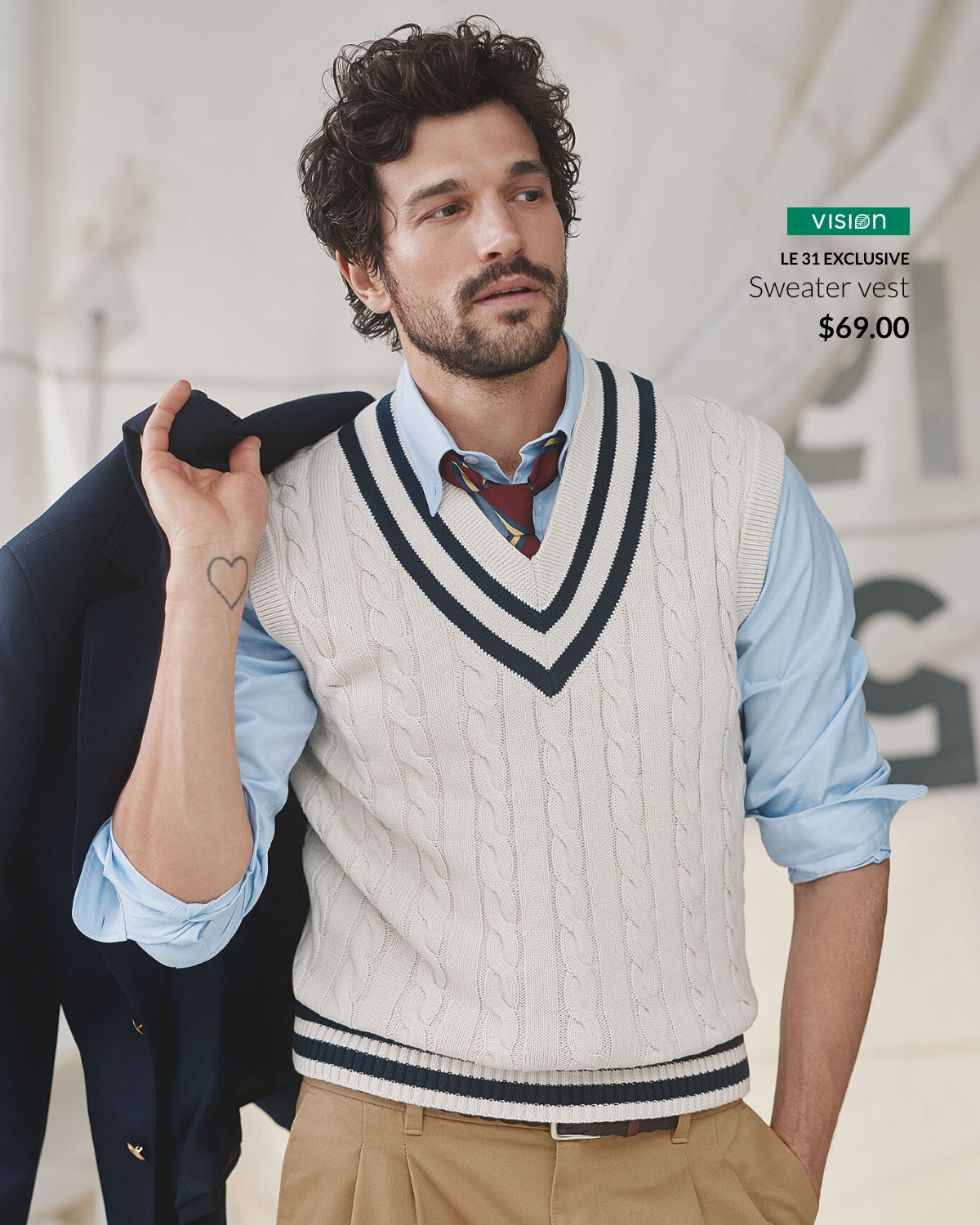 Man wearing a cream-coloured sweater vest at $69