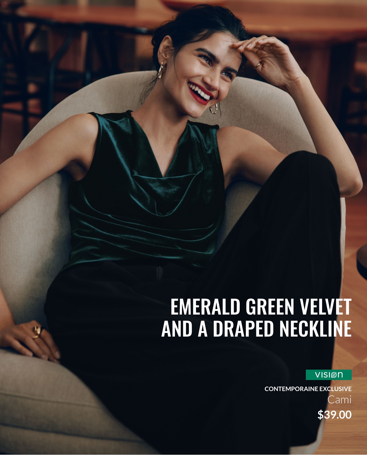 Woman wearing a green velvet camisole with a draped neckline and black pants.