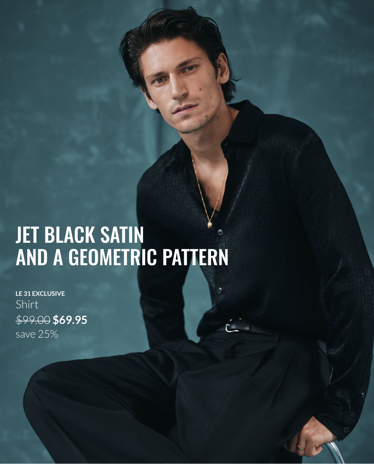 Man wearing a black satin shirt with geometric pattern for $69.95 instead of $99 and black pants.