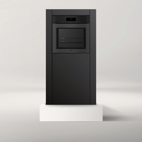 Miele oven on white pedestal against gray background 