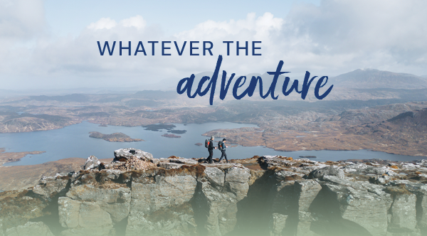 WHATEVER THE ADVENTURE. Image depicts a man and a woman hiking at a distance, a loch visible in the background. 