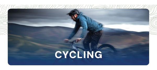 CYCLING. A blurry image depicting a man cycling at speed.