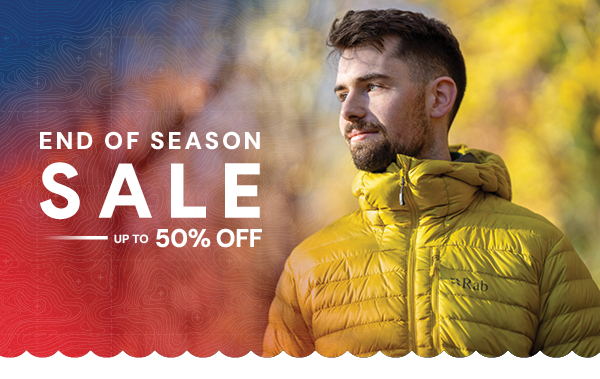 END OF SEASON SALE: UP TO 50% OFF. A man wearing Rab Men's Microlight Alpine Jacket in Yellow.