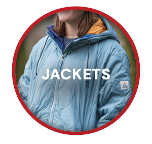 JACKETS. A woman wearing Passenger Women's Flora 2.0 Long Insulated Parka Jacket in Blue. 