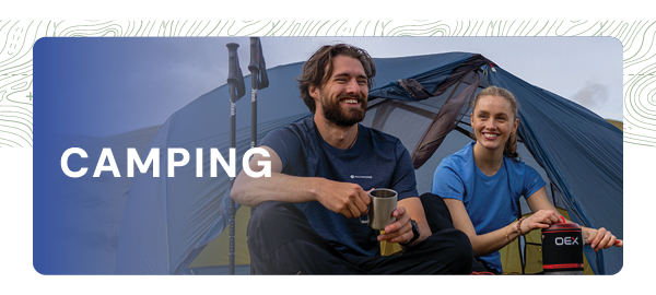 CAMPING. A man and a woman sit outside a tent on a sunny day. 