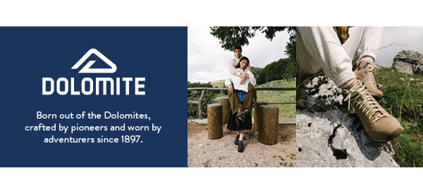DOLOMITE. Born out of the Dolomites, crafted by pioneers and worn by adventurers since 1897. Two images to the centre and right of the banner. In the centre, a man and woman embrace, both wearing Dolomite shoes. On the right, a close up on a pair of Dolomite Men's Cinquantaquattro Low FG Evo GORE-TEX Shoes