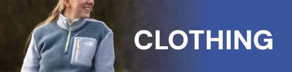 CLOTHING. A woman wearing The North Face Women's Yumiori 1/4 Zip Fleece Jacket in Grey.