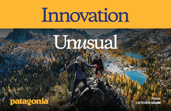 PATAGONIA: INNOVATION UNUSUAL. A high-angled shot looking down at two hikers. A forest sprawls behind them. 