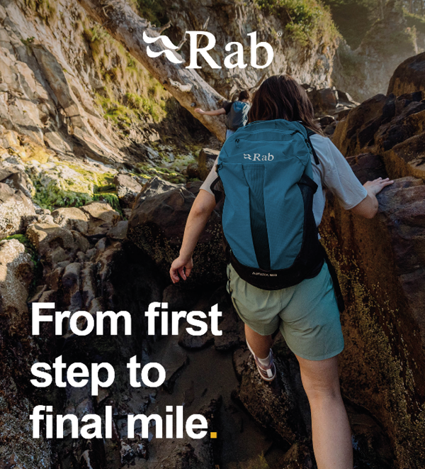 Rab: From first step to final mile. Two hikers scramble through a valley, wearing Rab Airox Backpacks. 