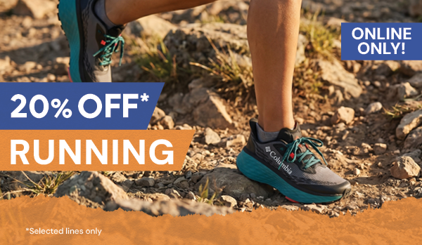 20% OFF RUNNING* *Selected lines only. A woman runs on the trail wearing Columbia Women's Konos Trillium ATR Shoes in Grey/Blue.