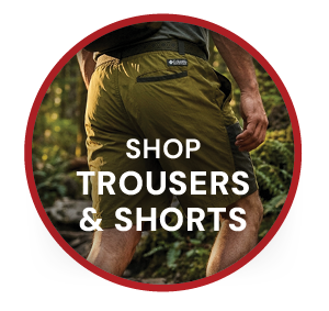 SHOP TROUSERS & SHORTS. A man wearing Columbia Men's Sequoia Grove Woven Walking Shorts in Green. 