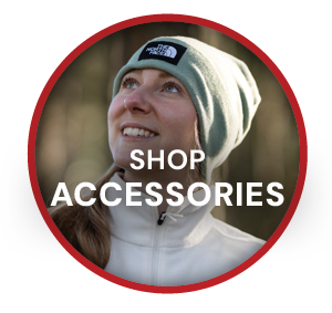SHOP ACCESSORIES. A woman wearing The North Face Unisex Dock Worker Beanie in Green. 