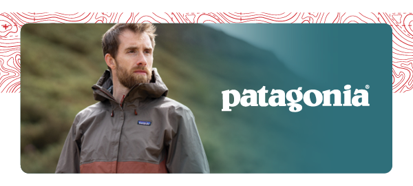 PATAGONIA. A man wears Patagonia Men's Torrentshell 3L Rain Jacket in Brown.
