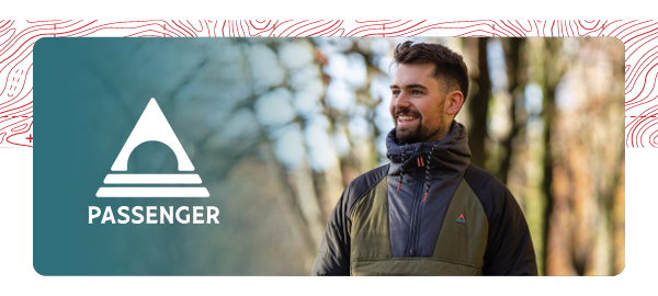 PASSENGER. A man wears Passenger Men's Oceanic Insulated 1/2 Zip Jacket in Green/Black