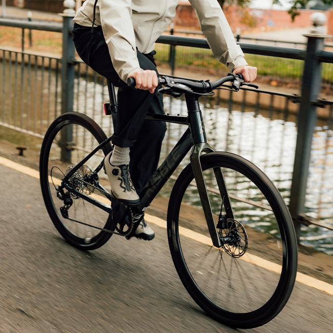 Man riding the CGR AL along a canal