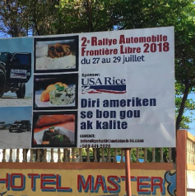 A billboard in Cap-Haitien for a backroad automobile rally reads “American rice is tasty and of good quality,” sponsored by USA Rice. Photo by Victoria Koski-Karell, 2019.