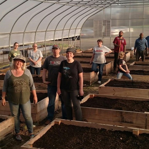 Training microfarmers; photo provided by authors.