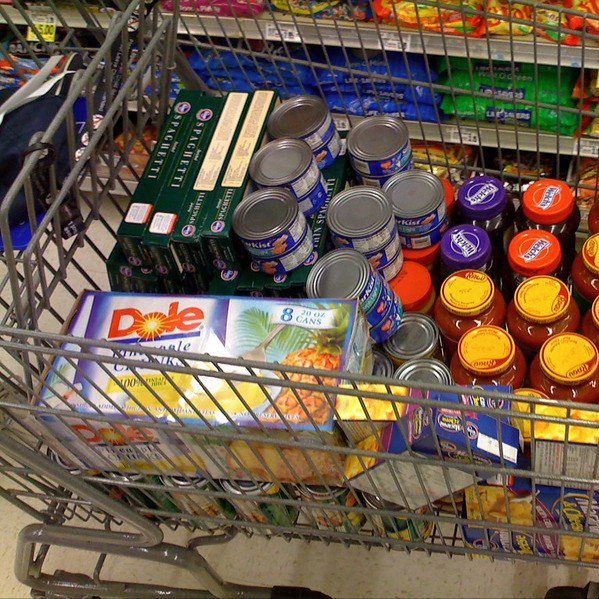Photo of a cart of food at a food pantry. Photo at Flickr.